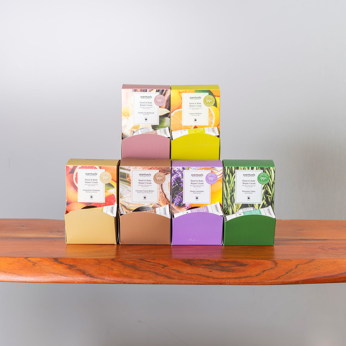 Six Scentuals mini hand repair creams displays.